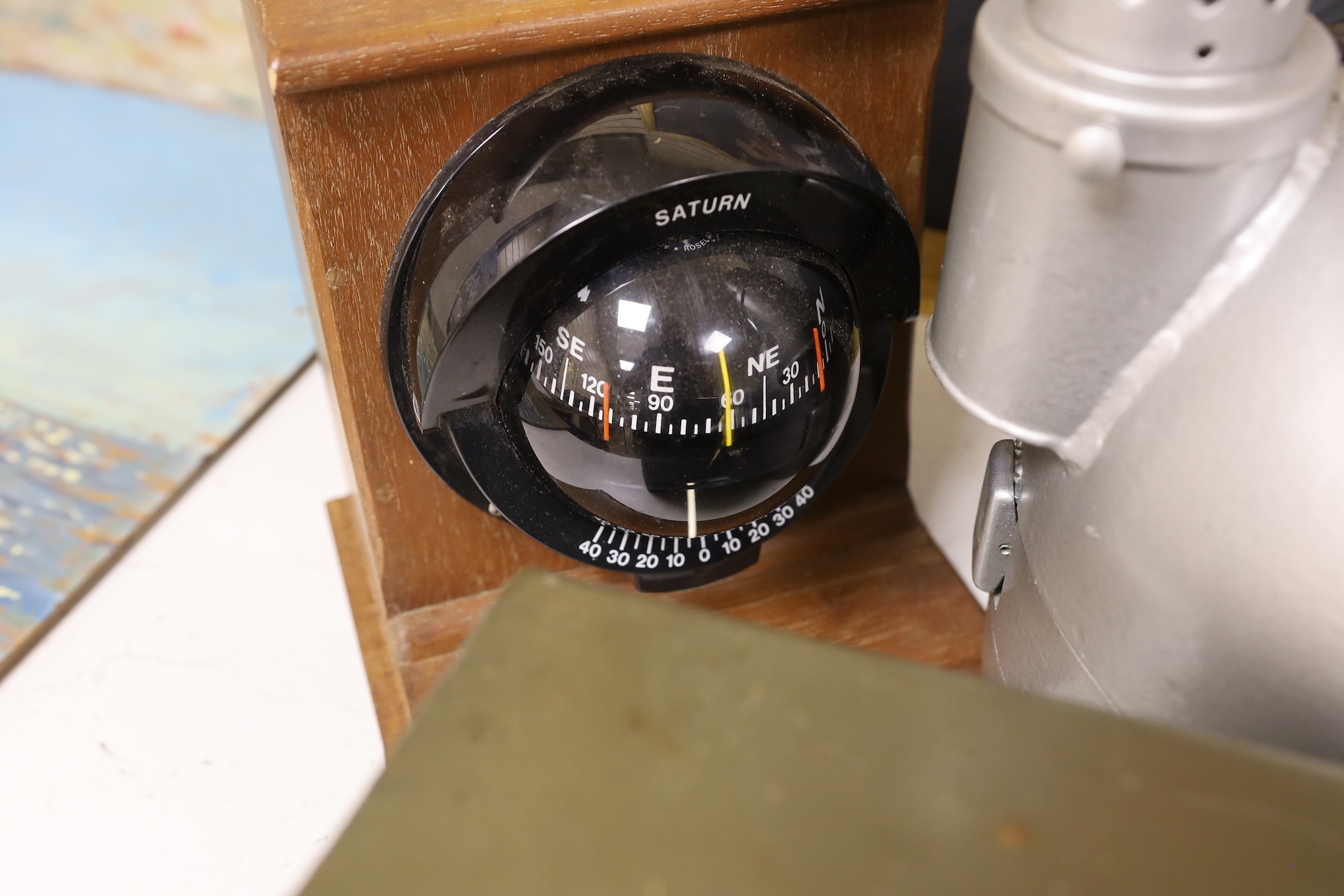A World War Two gun-sight, ship's binnacle, barograph, etc.